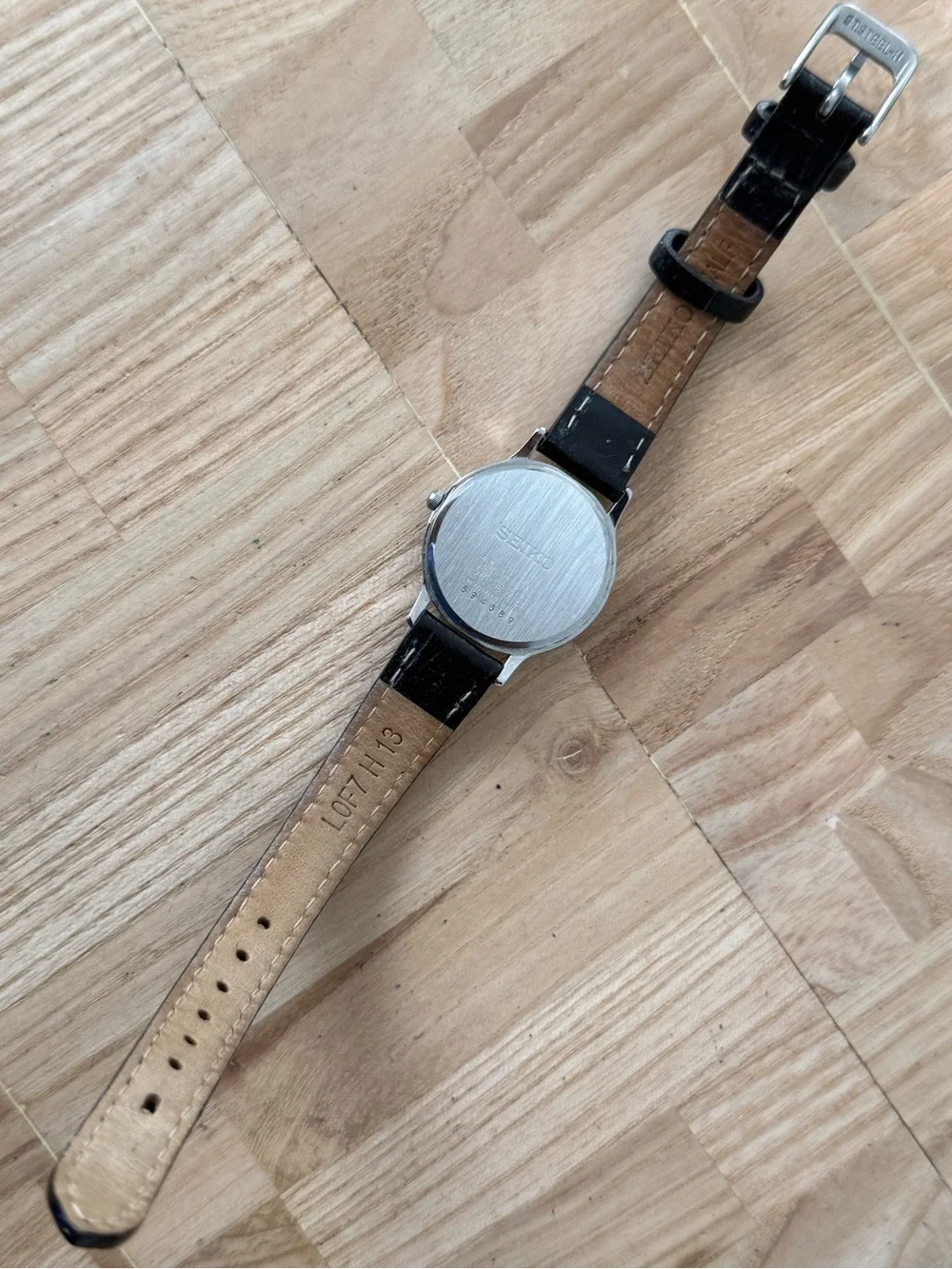 Seiko Solar Ladies Watch White Round Dial Black Leather Strap Stainless Case